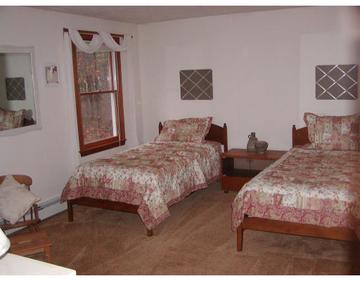 11 Quail Run Road Bellingham, MA 02019 - Photo 16 of 22 a bedroom with two beds and painting on the wall