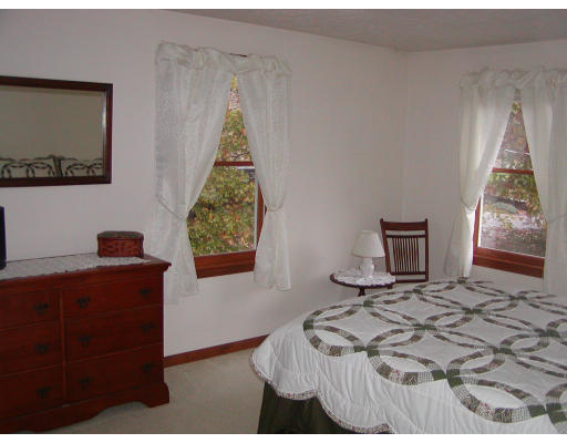 11 Quail Run Road Bellingham, MA 02019 - Photo 17 of 22 a bedroom with a bed and a window