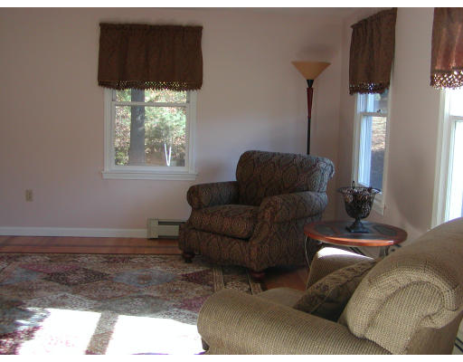 11 Quail Run Road Bellingham, MA 02019 - Photo 19 of 22 a living room with furniture and a window