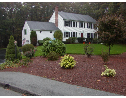 11 Quail Run Road Bellingham, MA 02019 - Photo 2 of 22 a front view of a house with a yard and garden