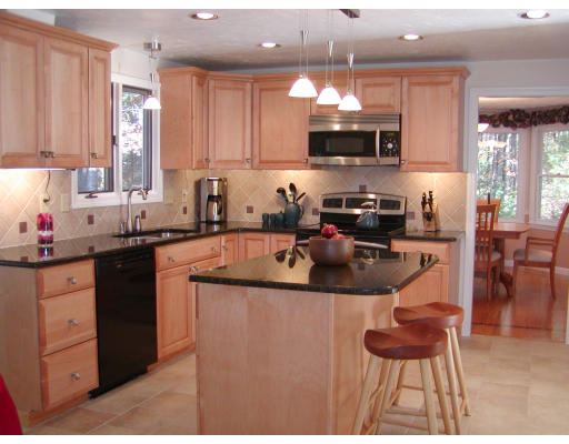 11 Quail Run Road Bellingham, MA 02019 - Photo 3 of 22 a kitchen with cabinets a sink and appliances