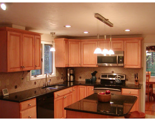 11 Quail Run Road Bellingham, MA 02019 - Photo 4 of 22 a kitchen with a stove a sink and a microwave