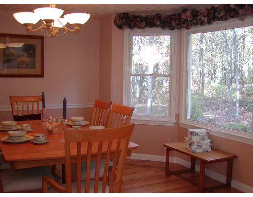 11 Quail Run Road Bellingham, MA 02019 - Photo 6 of 22 a view of a dining room with furniture window and outside view