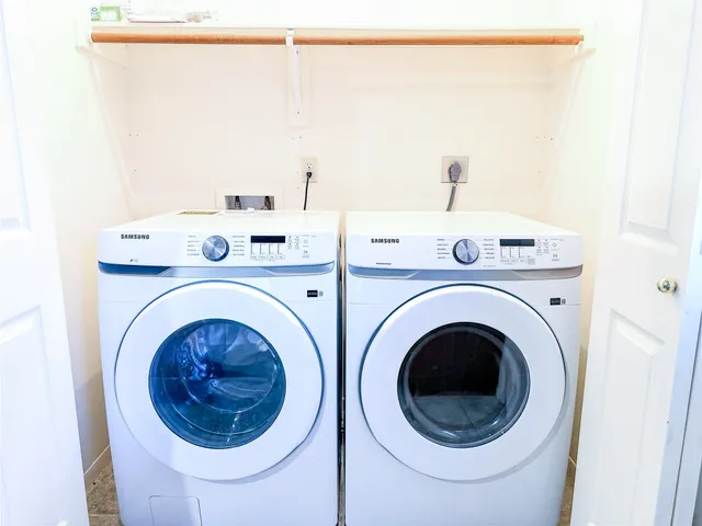 a utility room with dryer and washer