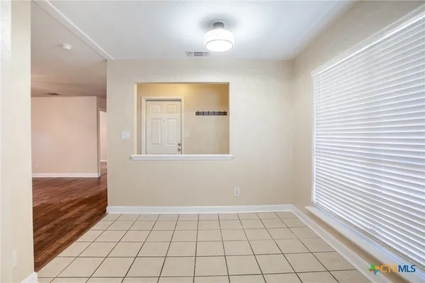 a view of an empty room and window