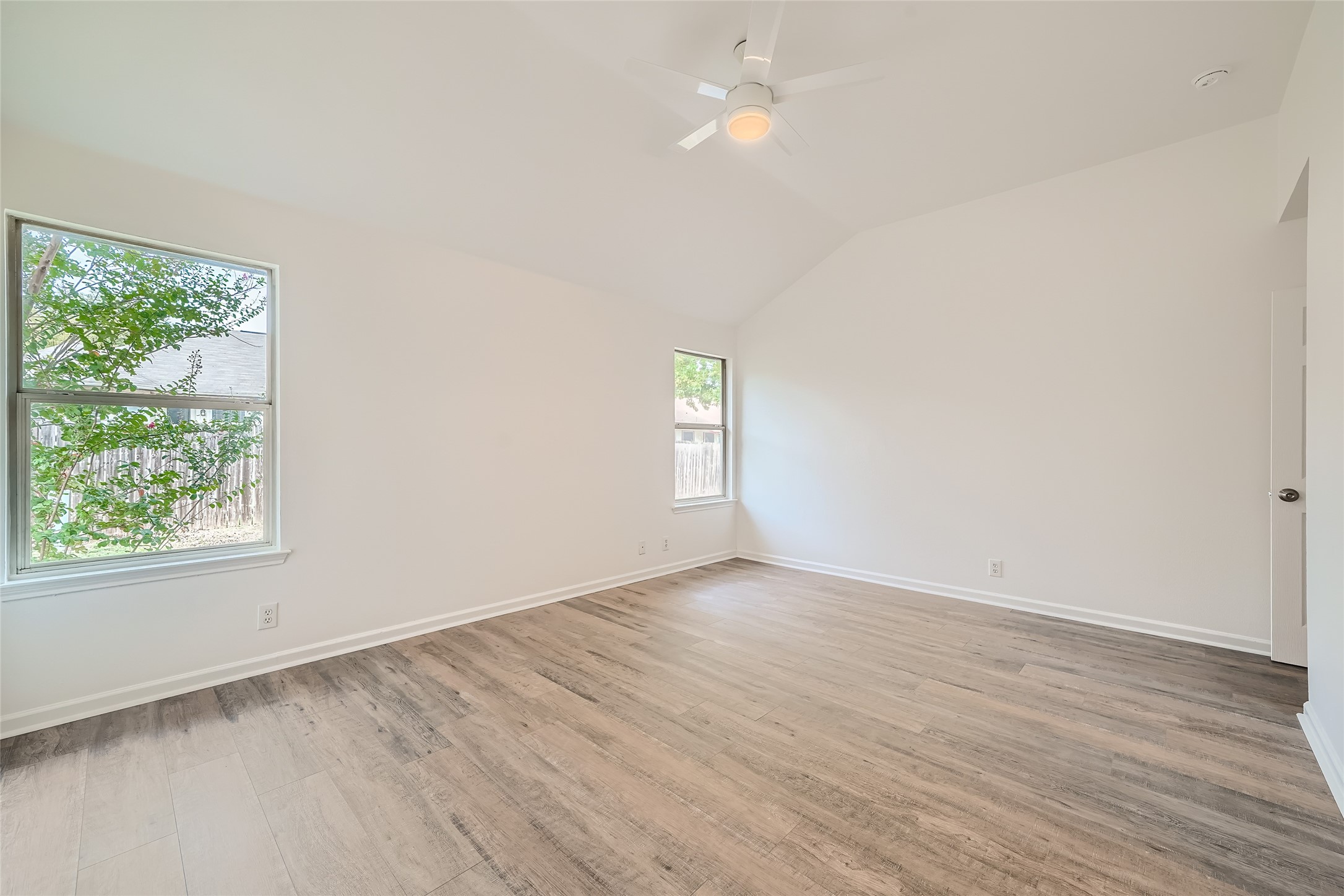 905 Jasmine Trail Georgetown, TX 78626 - Photo 16 of 31 an empty room with wooden floor and window