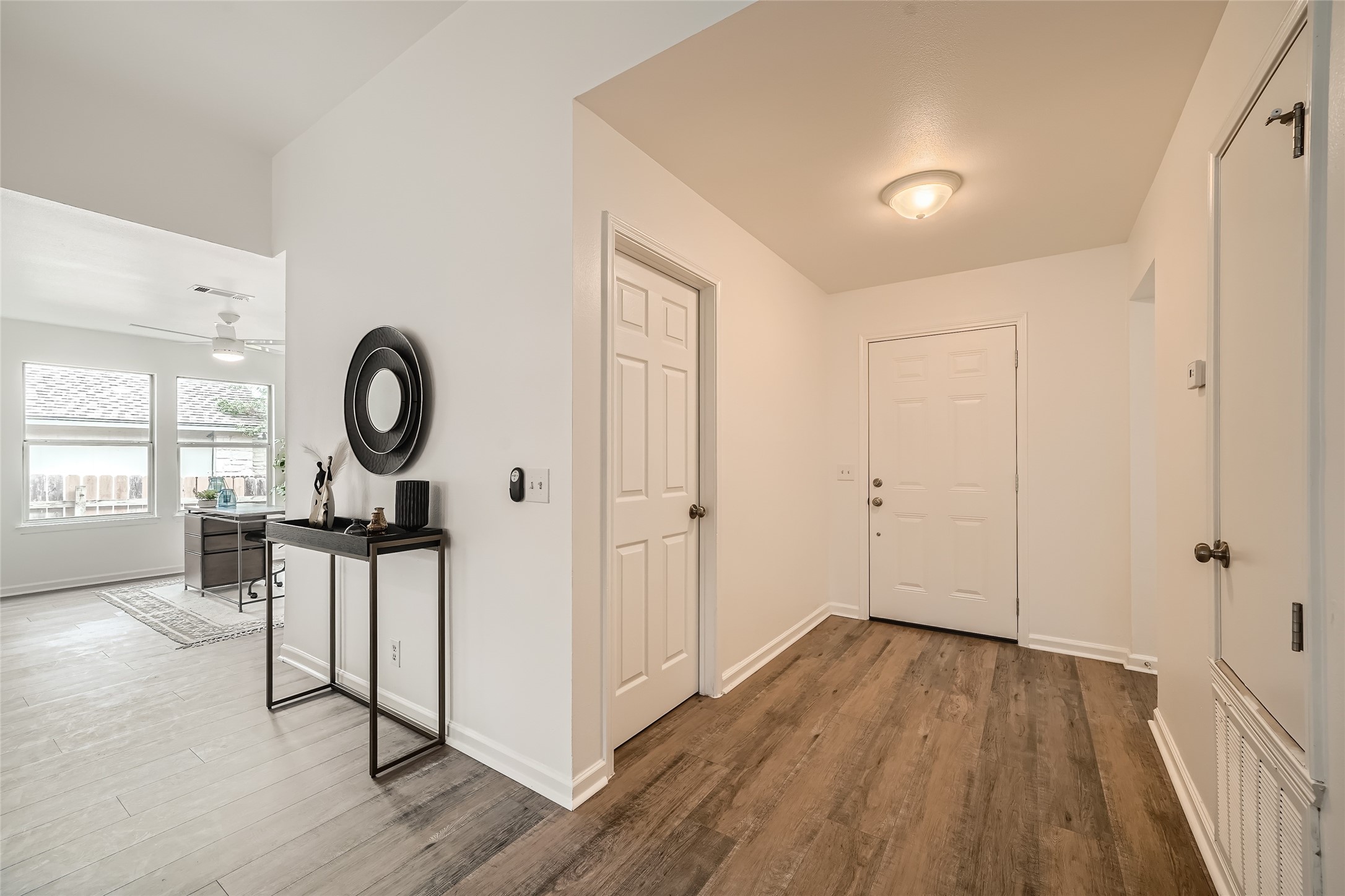 905 Jasmine Trail Georgetown, TX 78626 - Photo 24 of 31 a view of a room with wooden floor and windows