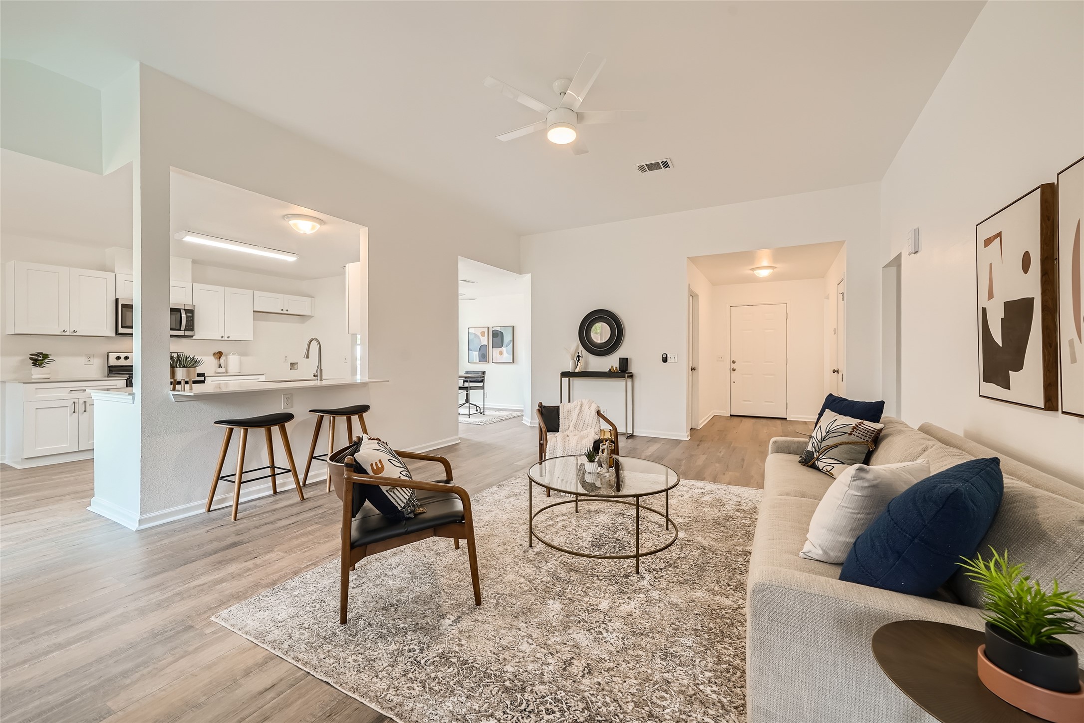 905 Jasmine Trail Georgetown, TX 78626 - Photo 5 of 31 a living room with furniture and a wooden floor