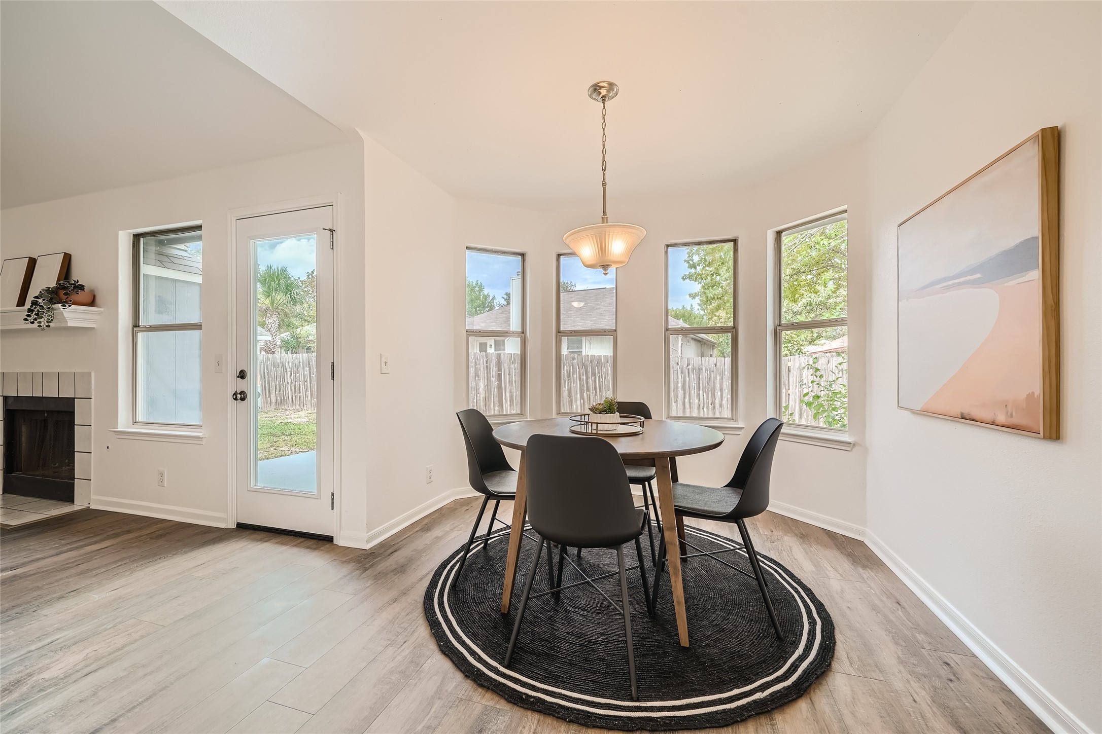 905 Jasmine Trail Georgetown, TX 78626 - Photo 6 of 31 a dining room with furniture a chandelier and wooden floor