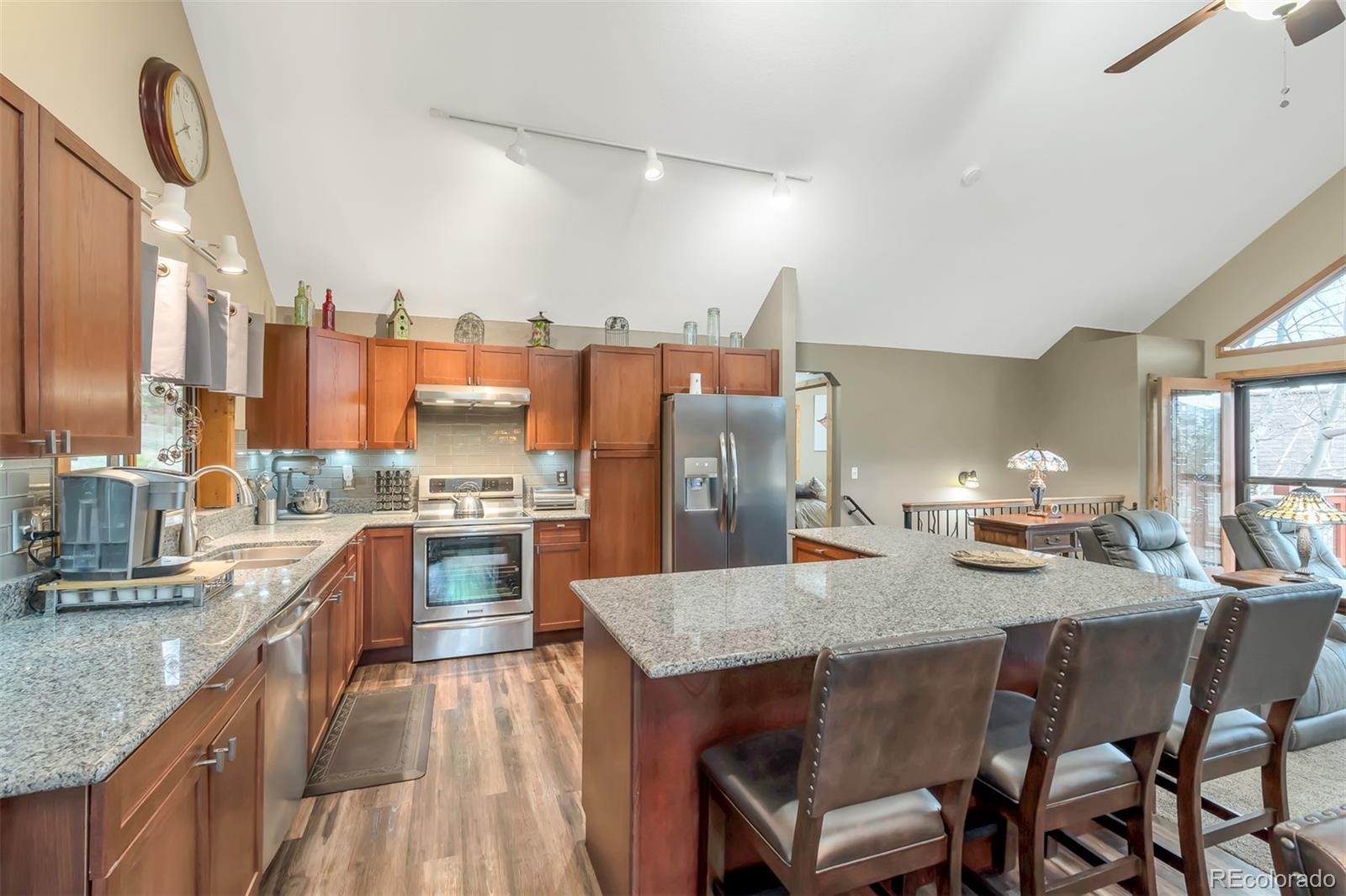 195 Bulldogger Road Bailey, CO 80421 - Photo 11 of 38 a kitchen with a stove a sink and a refrigerator