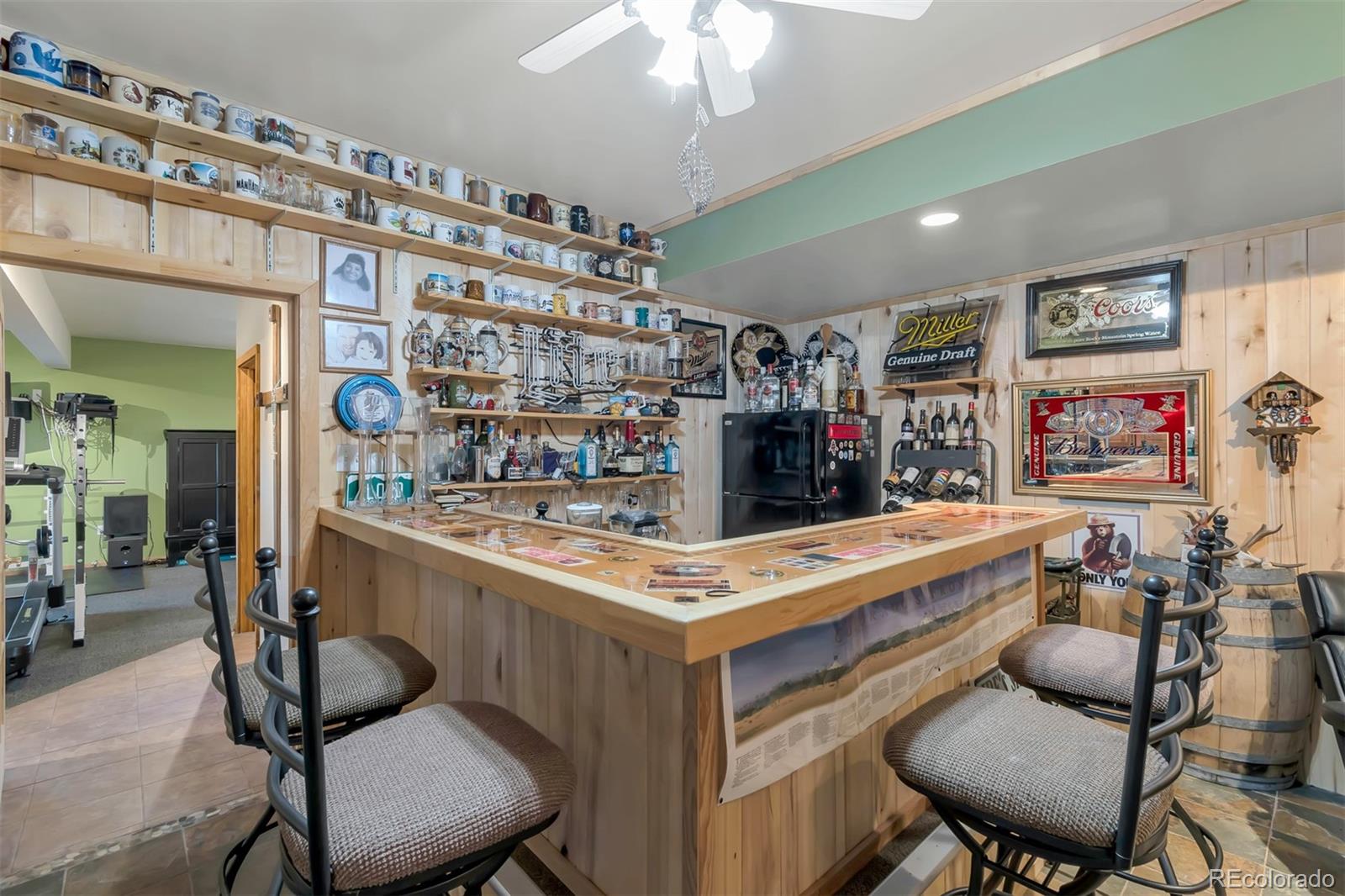 195 Bulldogger Road Bailey, CO 80421 - Photo 27 of 38 a room with furniture a flat screen tv and a table