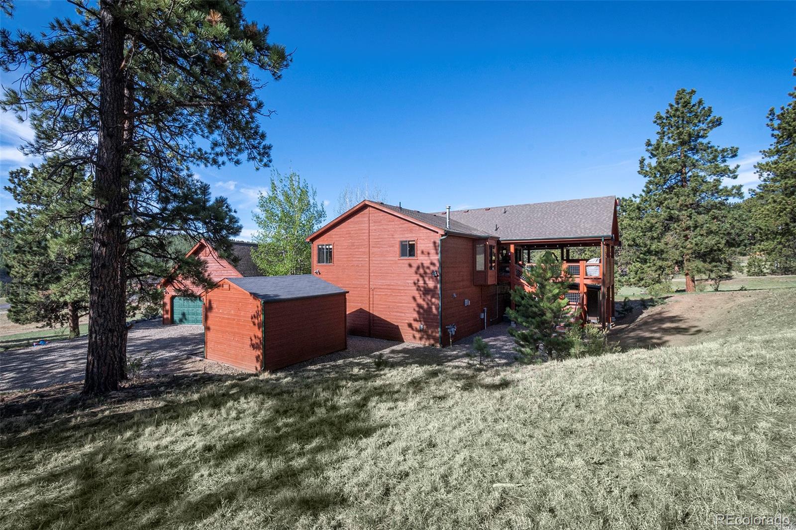 195 Bulldogger Road Bailey, CO 80421 - Photo 5 of 38 a front view of a house with a yard