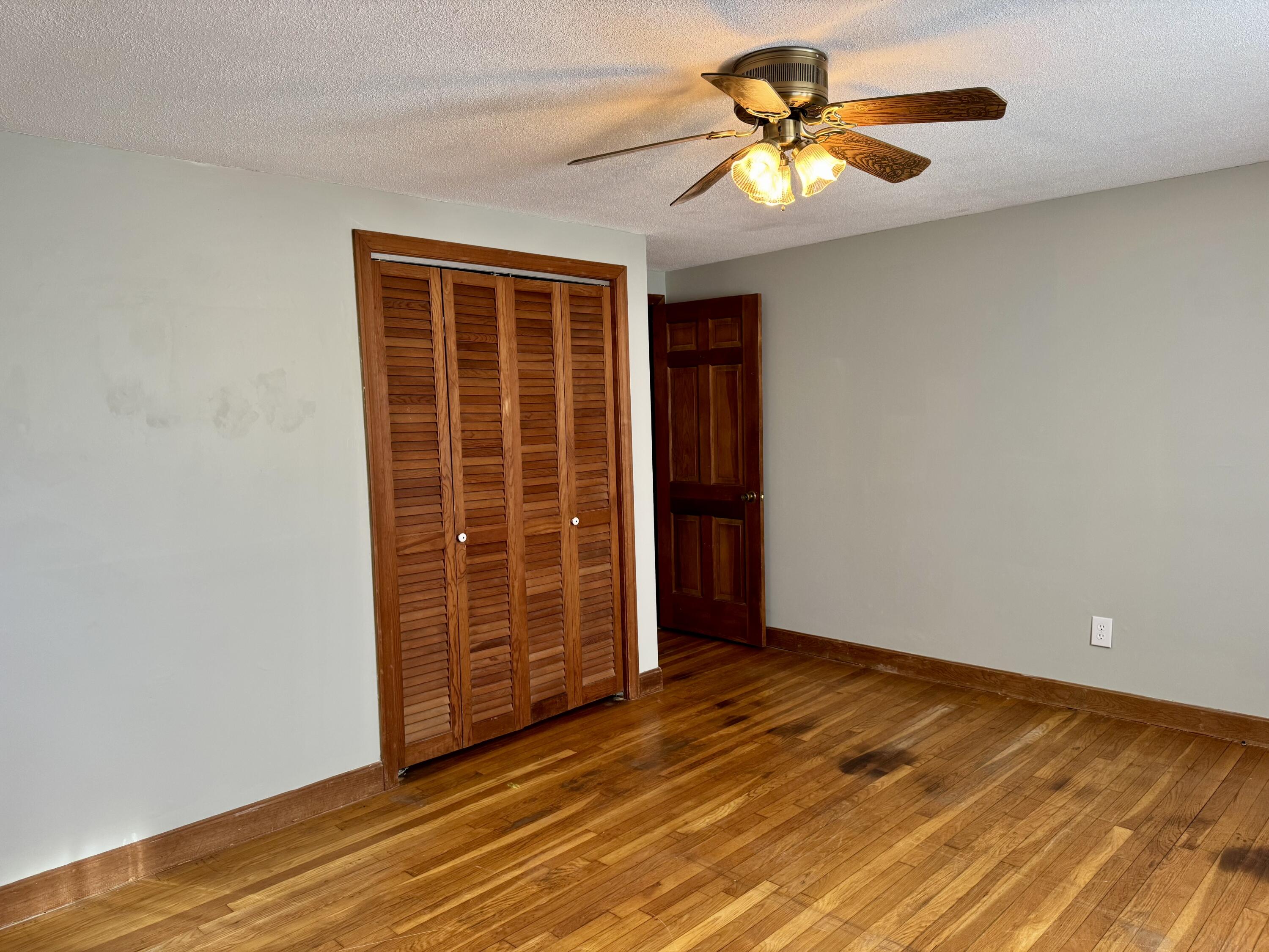 198 Great Marsh Road Centerville, MA 02632 - Photo 13 of 19 a view of an empty room with a window and a ceiling fan