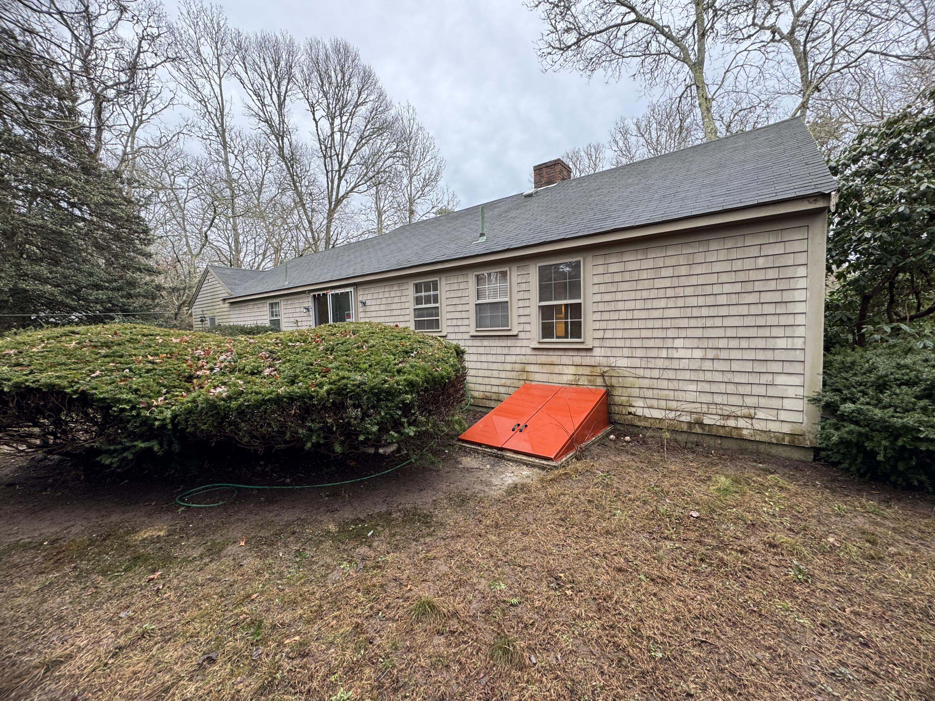 198 Great Marsh Road Centerville, MA 02632 - Photo 18 of 19 front view of a house with a yard