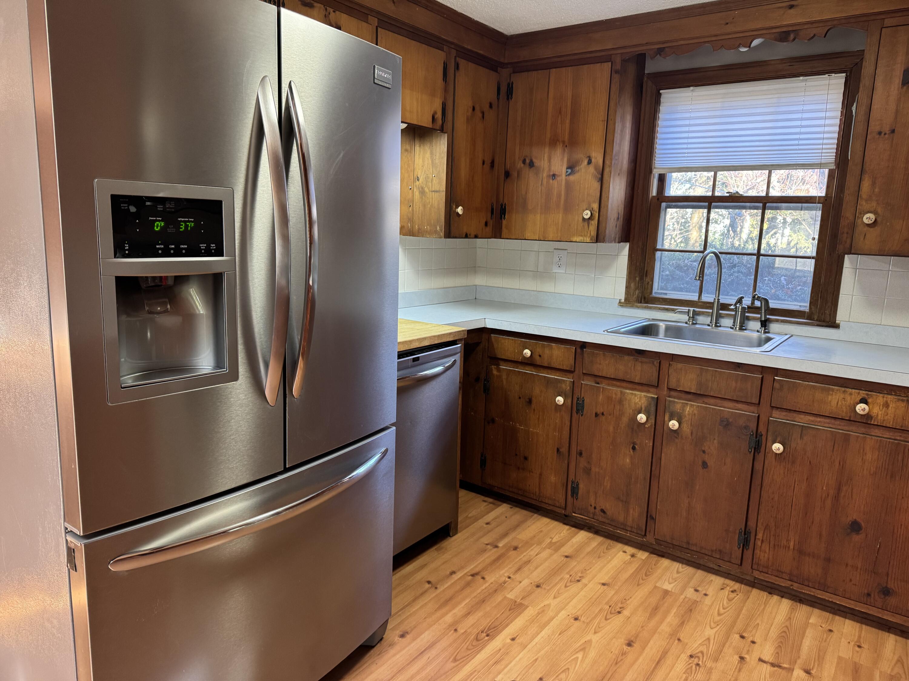 198 Great Marsh Road Centerville, MA 02632 - Photo 7 of 19 a kitchen with stainless steel appliances granite countertop a refrigerator and a sink