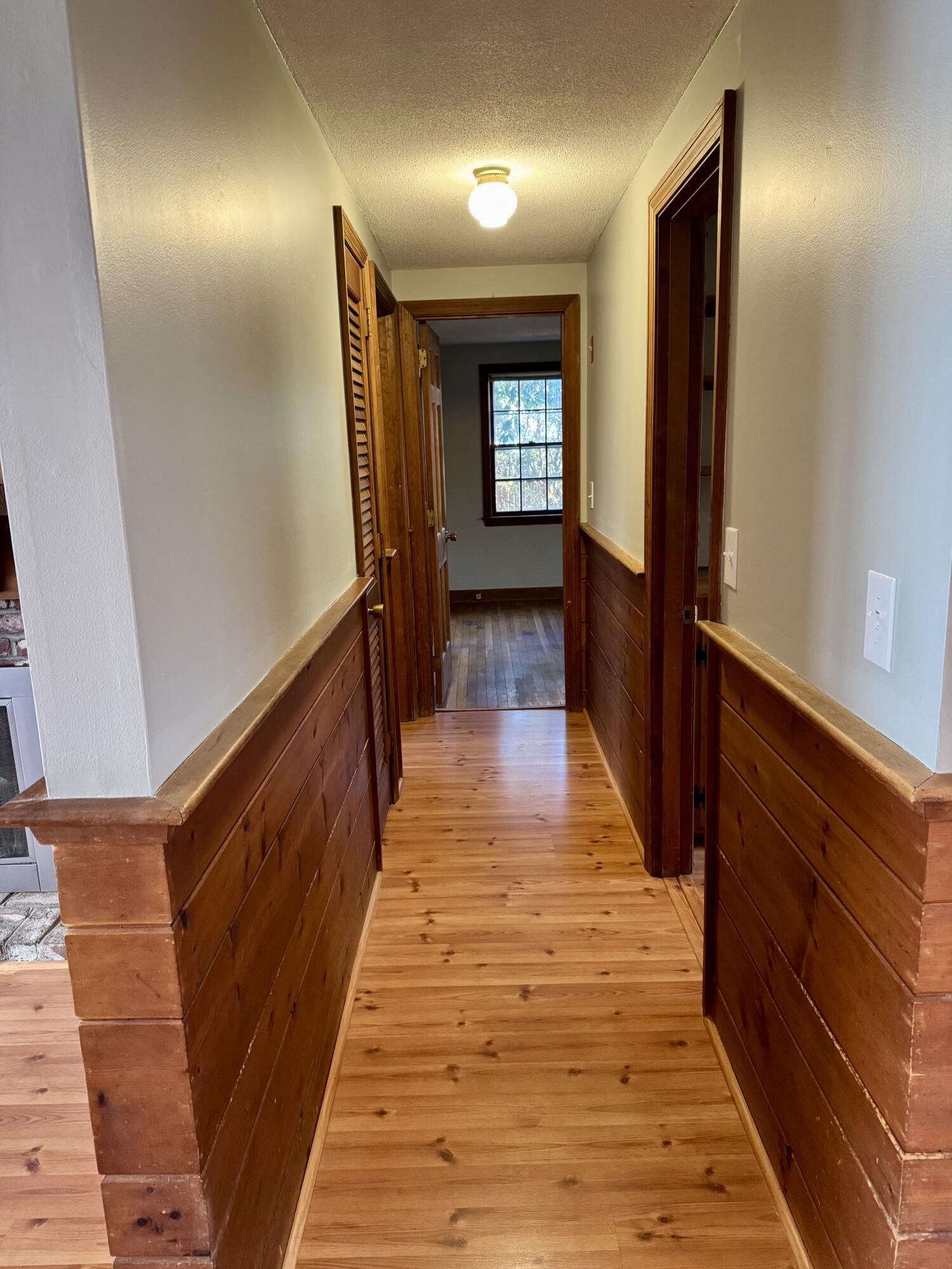 198 Great Marsh Road Centerville, MA 02632 - Photo 9 of 19 a view of a hallway with wooden floor and stairs