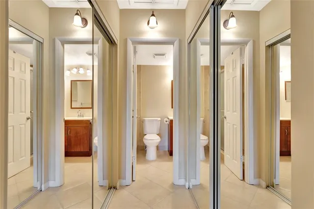 a view of a walk in closet and bathroom