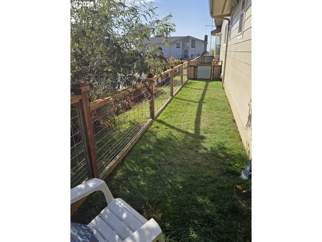 a view of balcony with a small yard