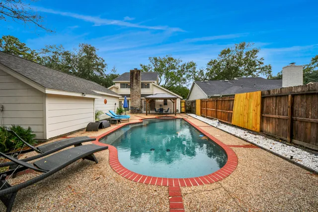 a house view with a swimming pool