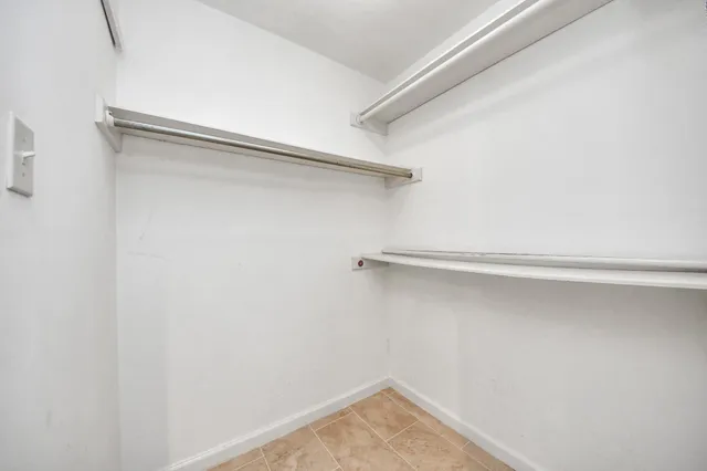 a view of a room with shelf on the wall