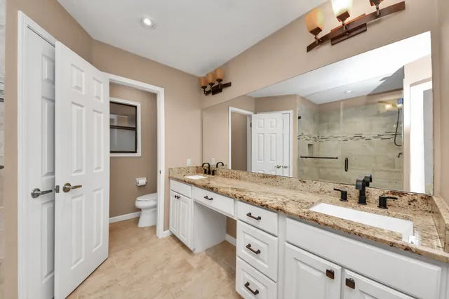 a view of staircase with white walls and a window