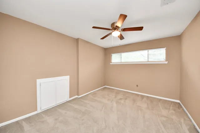 a view of a big room with wooden floor and closet