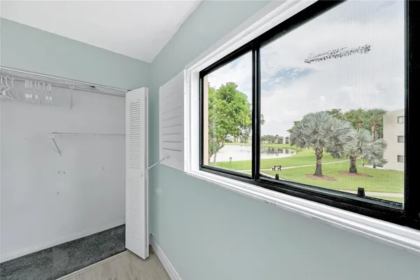 a view of a room with a large window