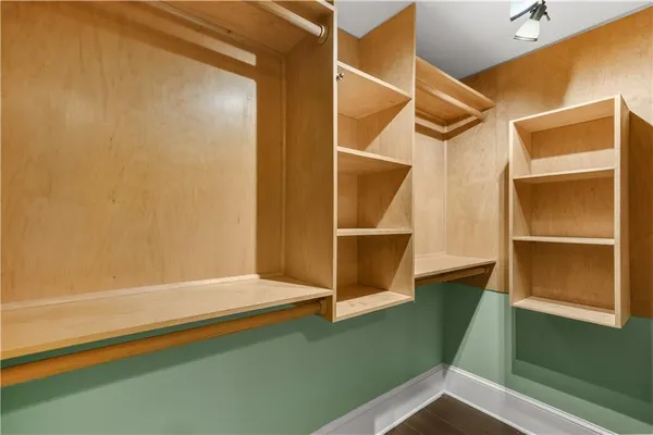 a bathroom with a bathtub and a window