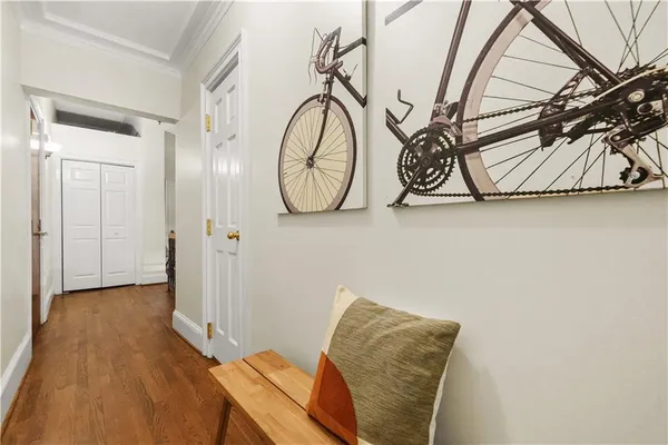 a view of an entryway with wooden floor