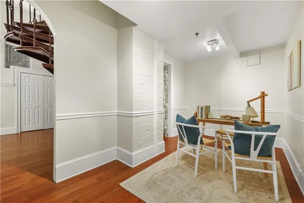 a view of a dining room with furniture and wooden floor