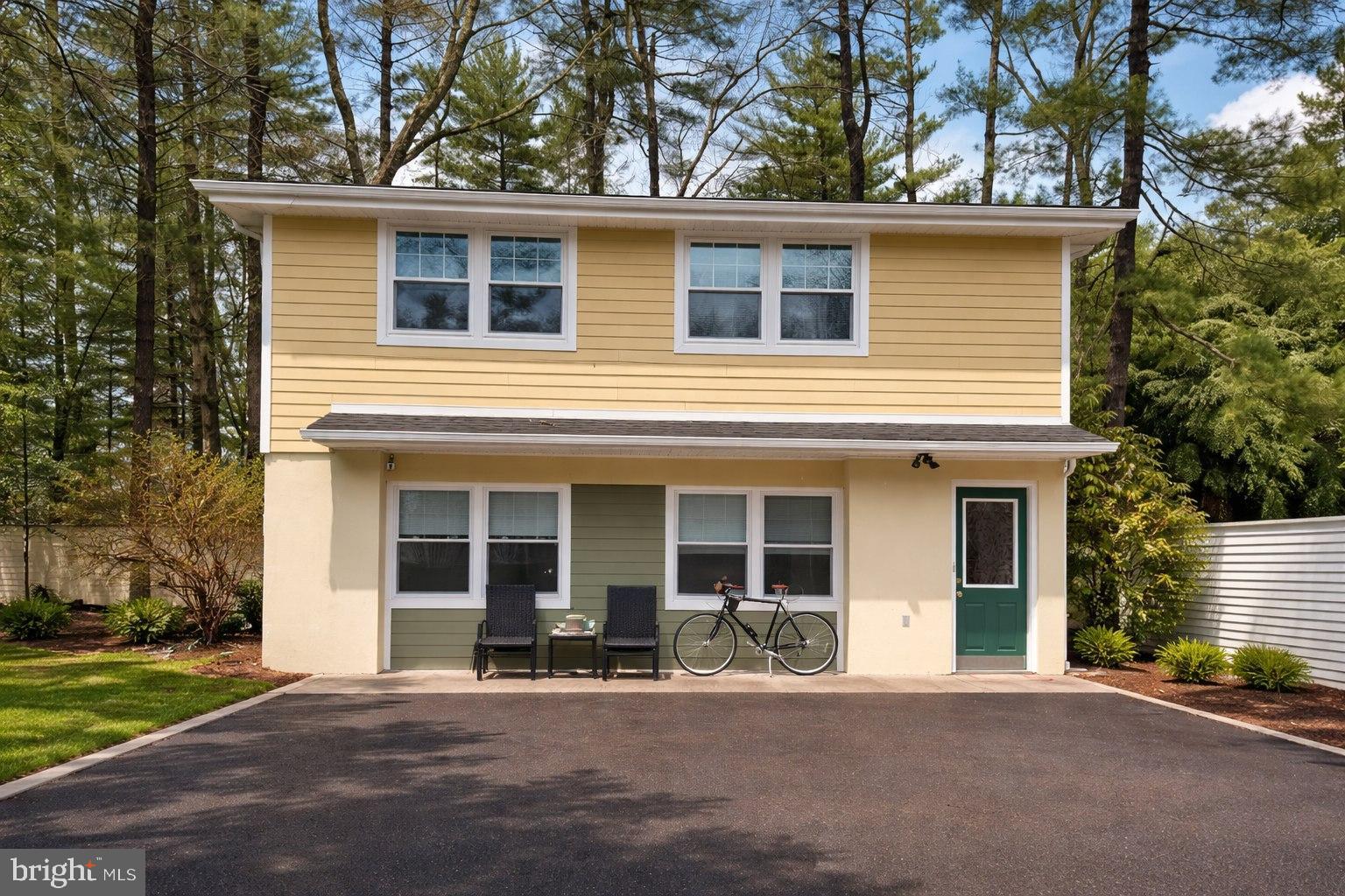 890 Lawrenceville Road Princeton, NJ 08540 - Photo 7 of 8 a front view of a house with a yard and a garage