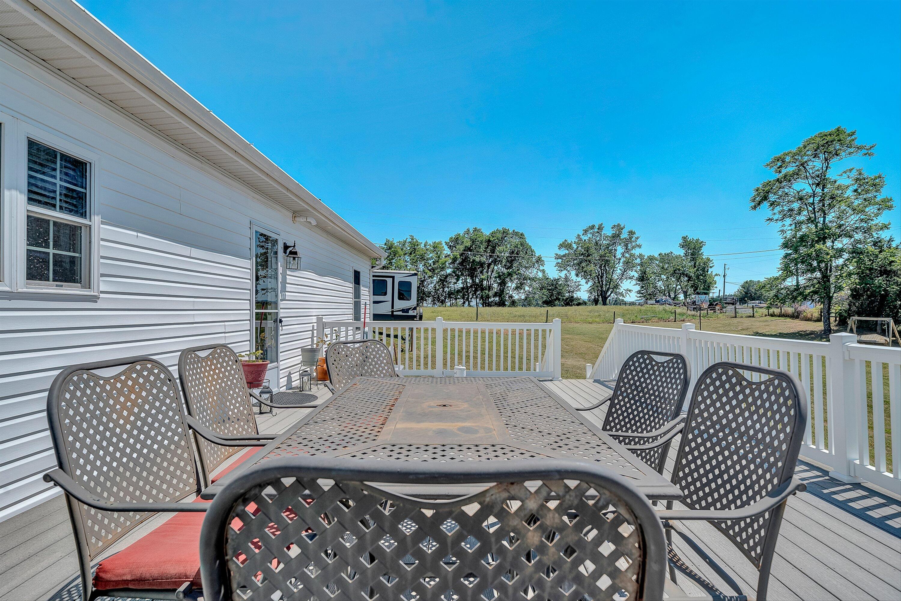 159 Simmons Creek Road Union Hall, VA 24176 - Photo 35 of 55 a view of balcony with wooden floor and outdoor seating