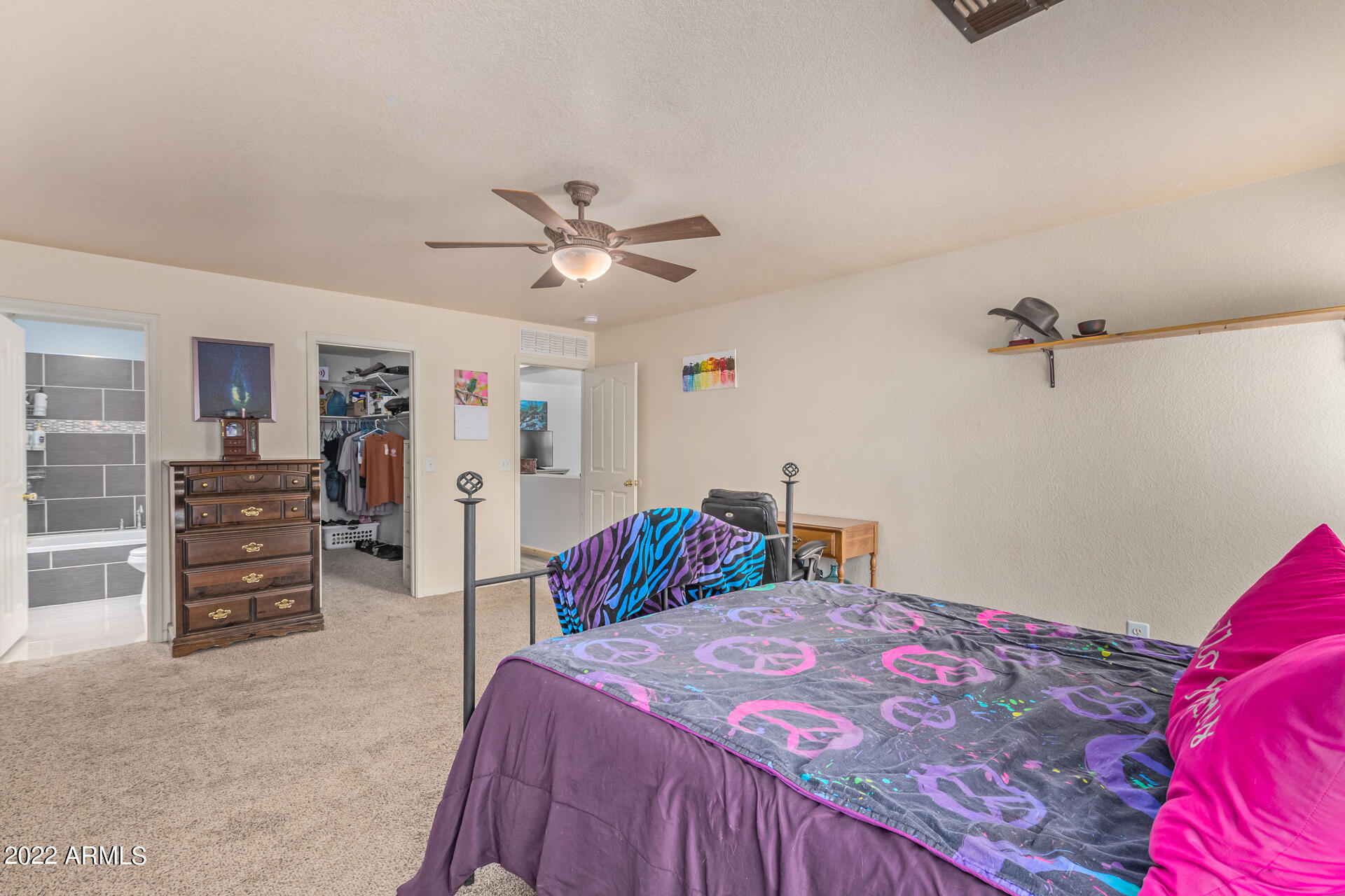 3466 South Chaparral Road Apache Junction, AZ 85119 - Photo 11 of 29 a bedroom with a bed and dresser