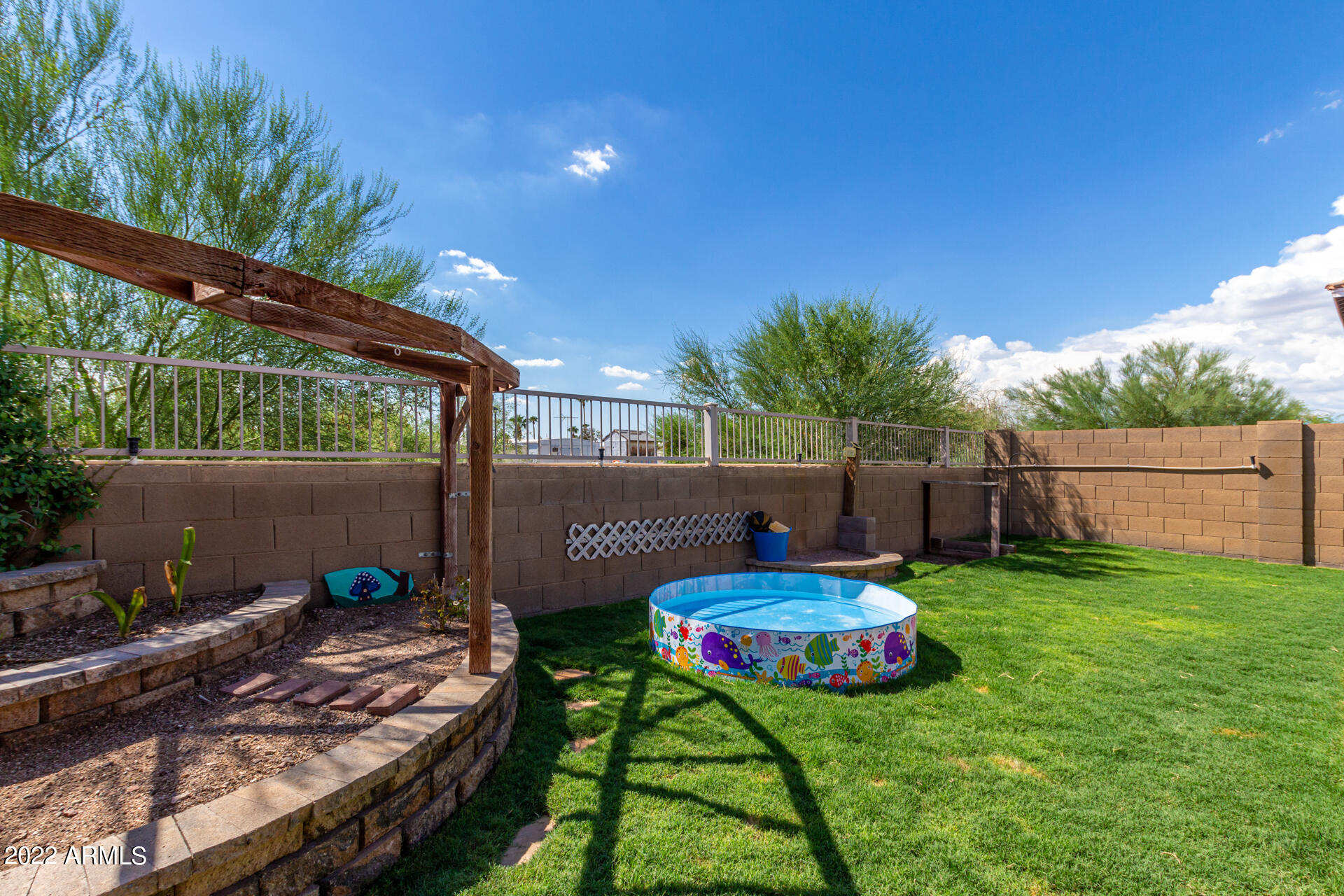 3466 South Chaparral Road Apache Junction, AZ 85119 - Photo 21 of 29 a view of a backyard with sitting area
