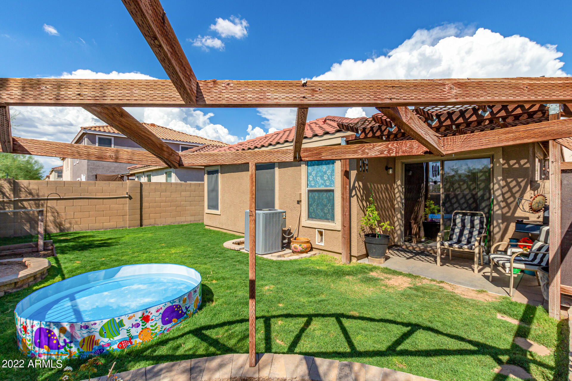 3466 South Chaparral Road Apache Junction, AZ 85119 - Photo 23 of 29 a view of a house with backyard sitting area and garden