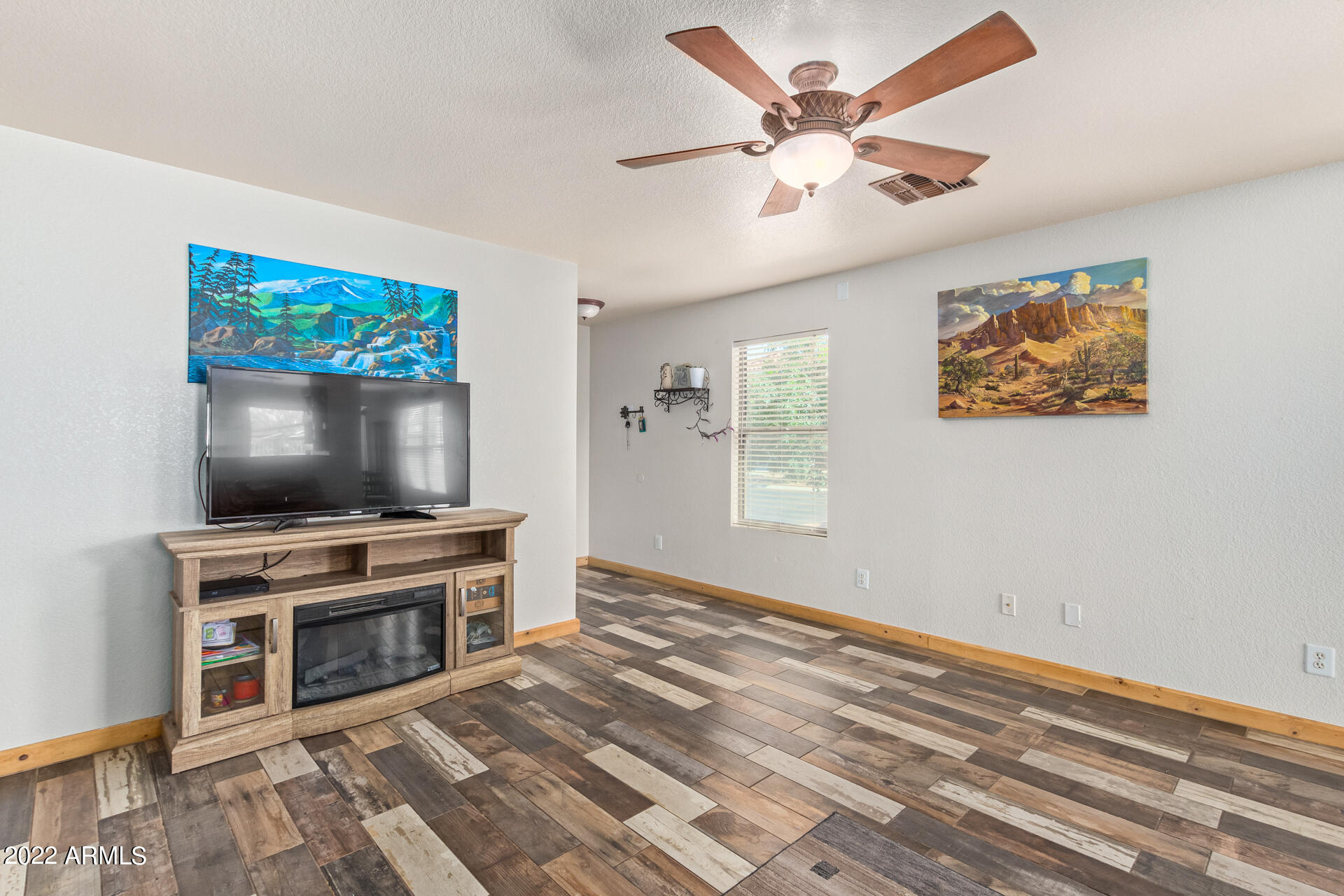 3466 South Chaparral Road Apache Junction, AZ 85119 - Photo 6 of 29 a living room with furniture and a flat screen tv