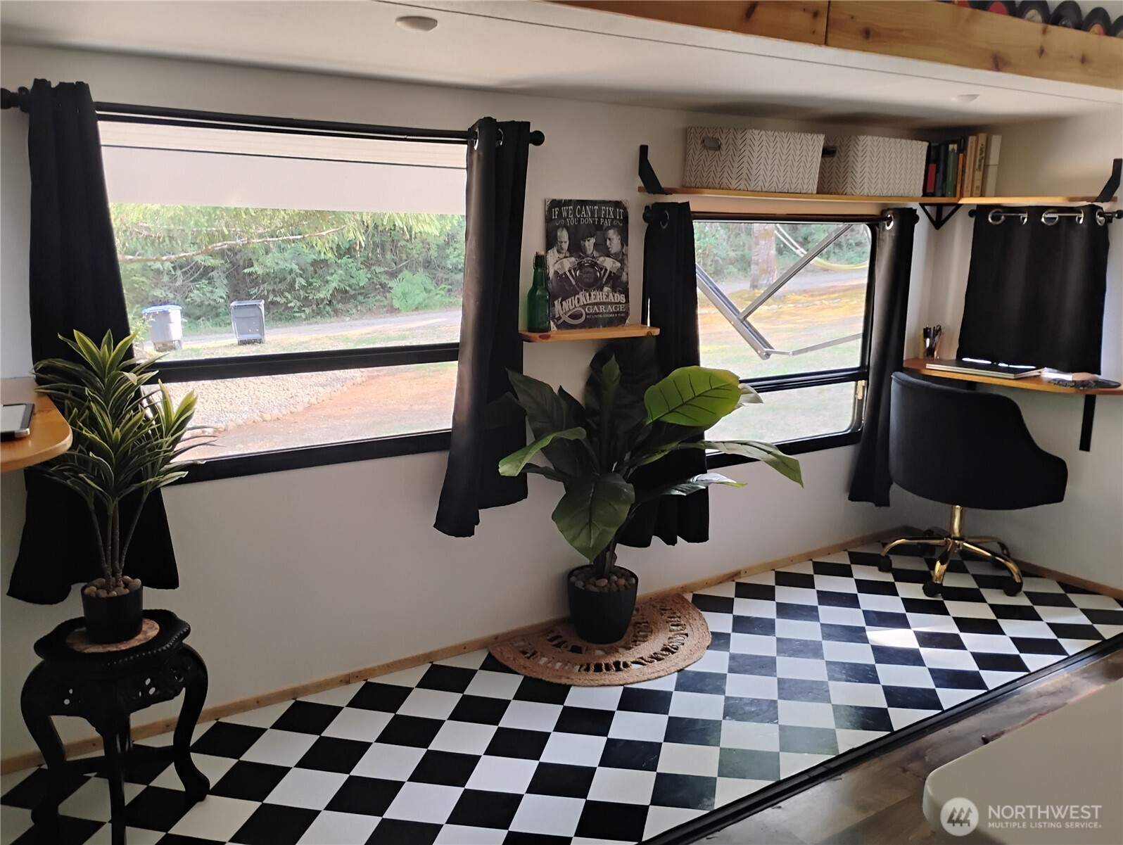 680 North Triton Heights Road Lilliwaup, WA 98555 - Photo 12 of 39 a room with gym equipment and a window