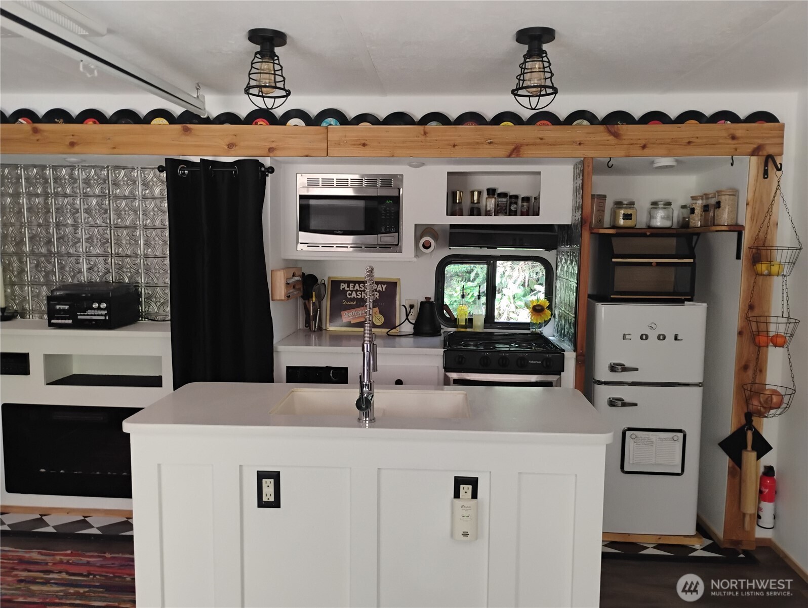 680 North Triton Heights Road Lilliwaup, WA 98555 - Photo 13 of 39 a kitchen with stainless steel appliances a stove and a refrigerator