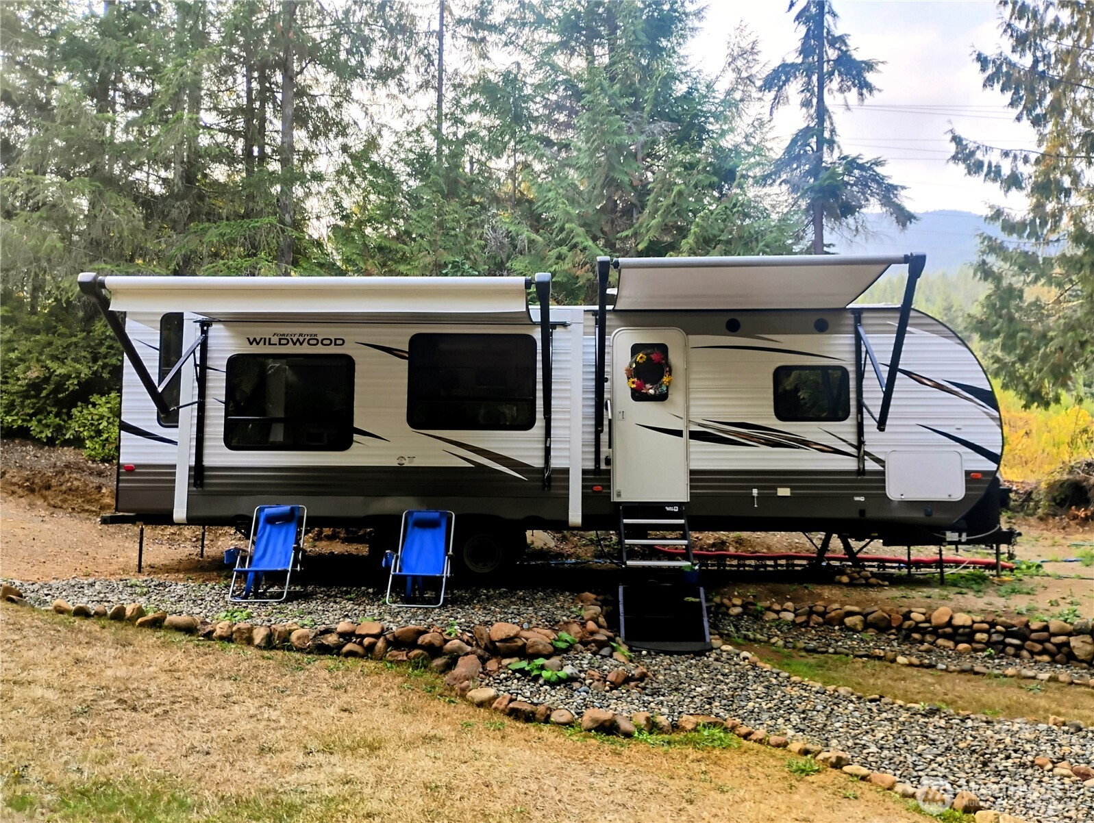 680 North Triton Heights Road Lilliwaup, WA 98555 - Photo 3 of 39 a view of a water fountain and a table in the back