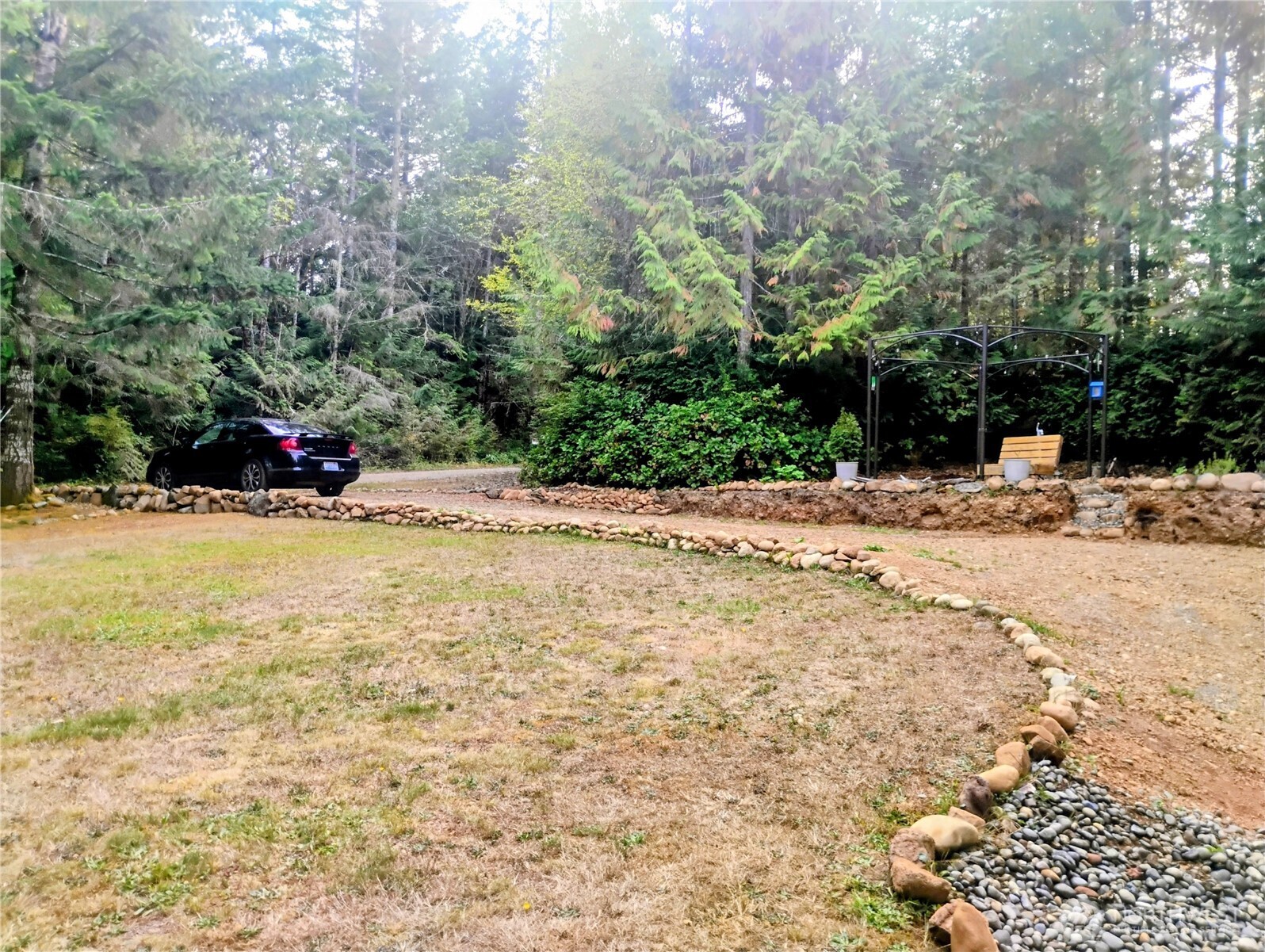 680 North Triton Heights Road Lilliwaup, WA 98555 - Photo 32 of 39 a view of swimming pool with a yard and trees
