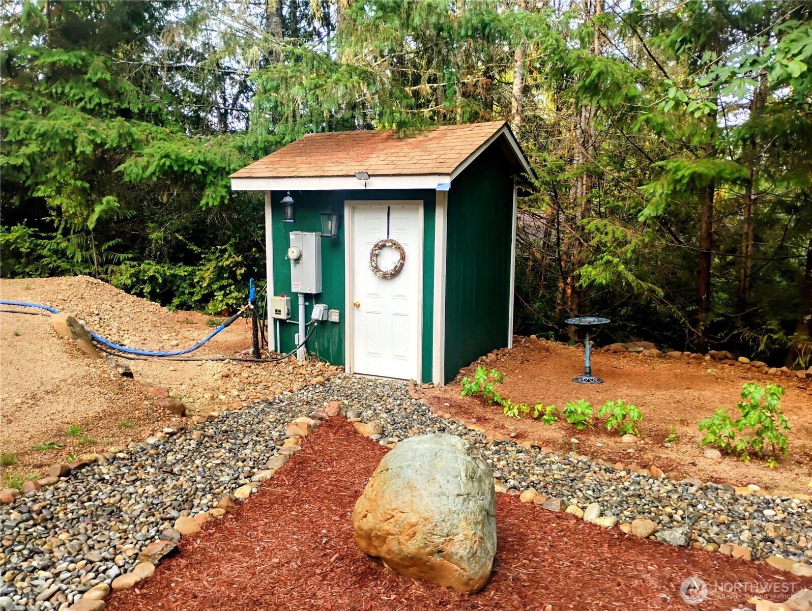 680 North Triton Heights Road Lilliwaup, WA 98555 - Photo 6 of 39 a view of a house with a yard