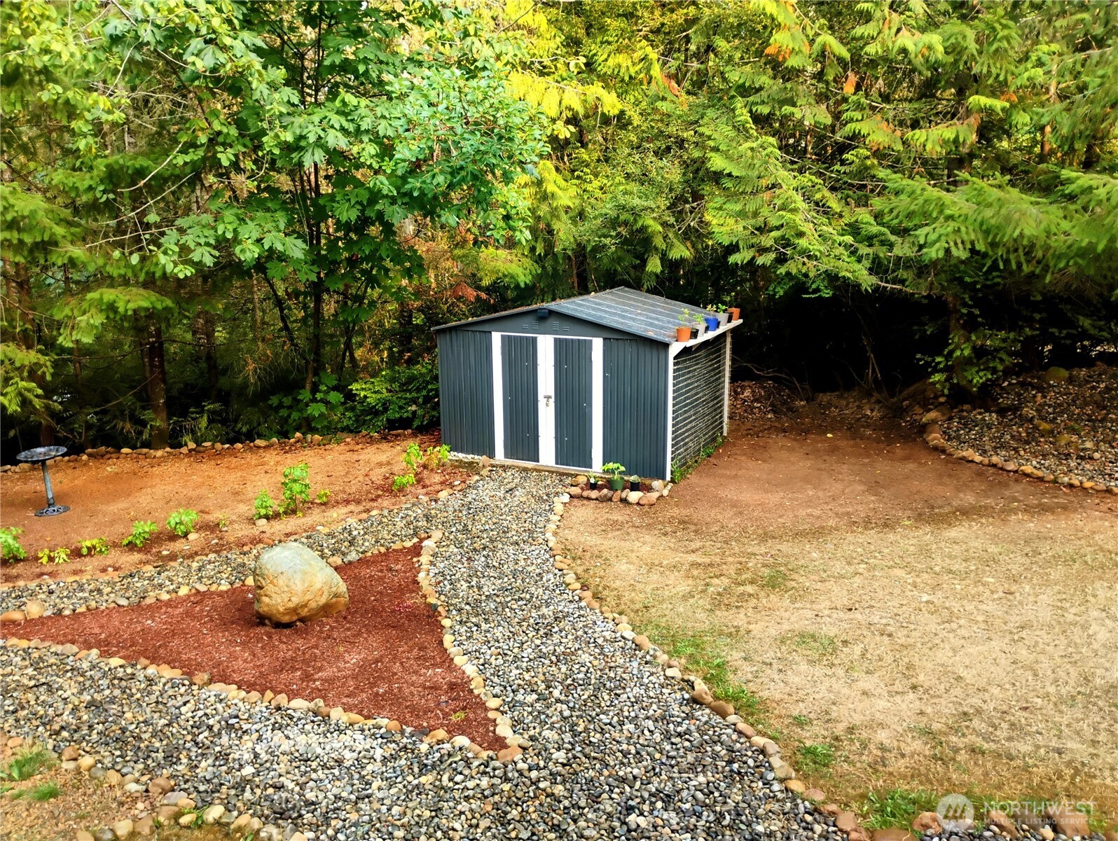 680 North Triton Heights Road Lilliwaup, WA 98555 - Photo 7 of 39 a view of a backyard of the house