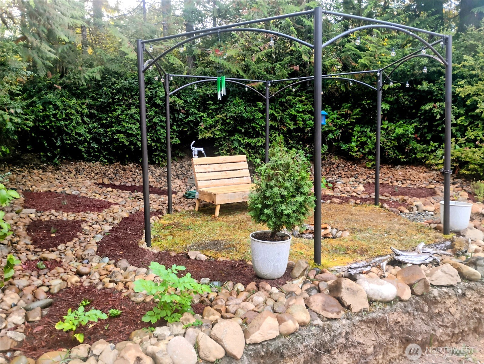 680 North Triton Heights Road Lilliwaup, WA 98555 - Photo 8 of 39 a view of a backyard with sitting area
