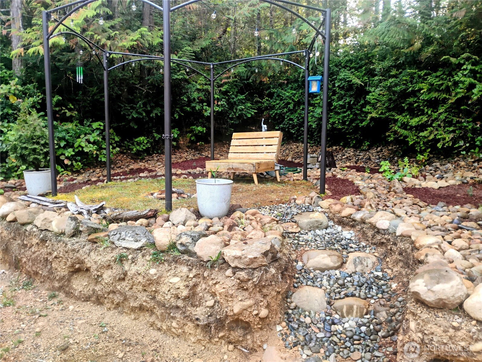 680 North Triton Heights Road Lilliwaup, WA 98555 - Photo 9 of 39 a view of back yard of the house with sitting space