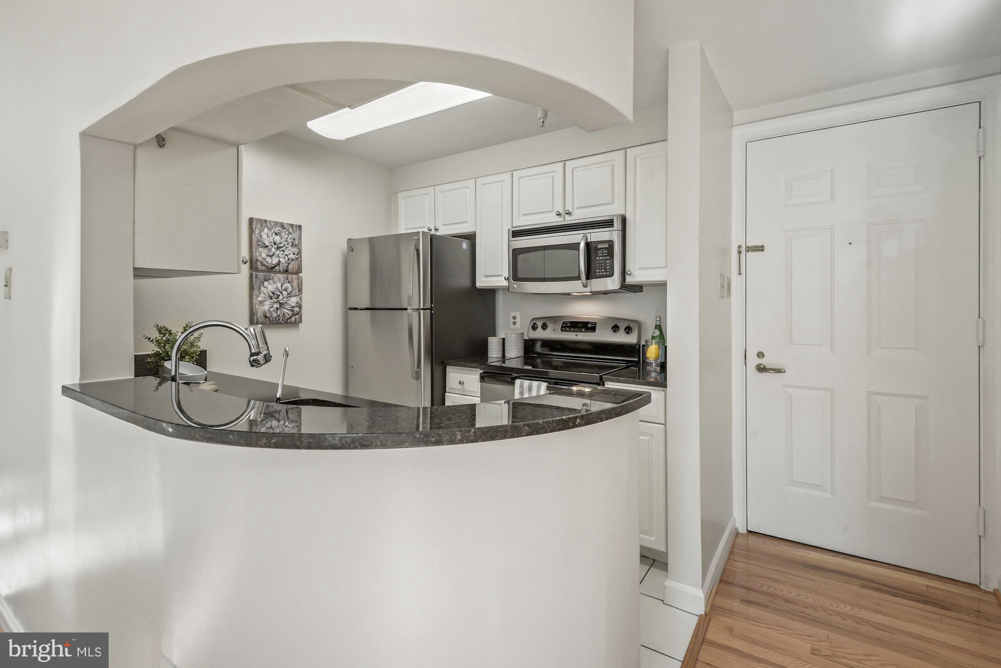 1619 R Street Northwest, Unit 101 Washington, DC 20009 - Photo 14 of 28 Urban kitchen with new stainless steel appliances