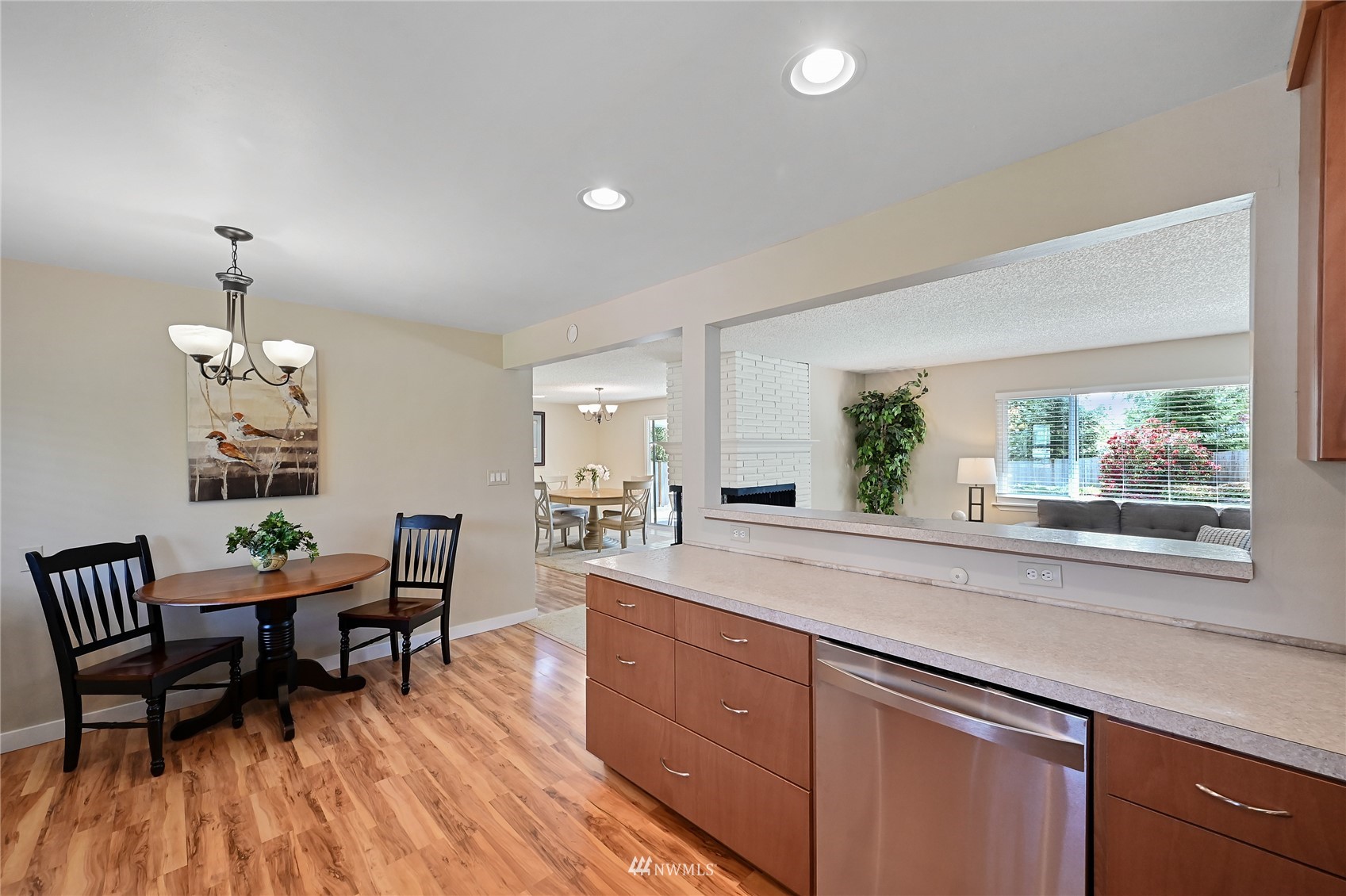 17341 Southeast 134th Street Renton, WA 98059 - Photo 11 of 36 a view of a dining room with furniture window and wooden floor