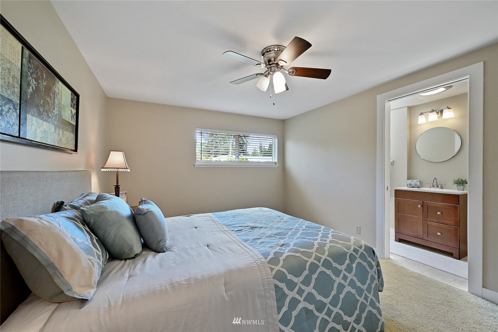 17341 Southeast 134th Street Renton, WA 98059 - Photo 15 of 36 a bedroom with a bed and a chandelier