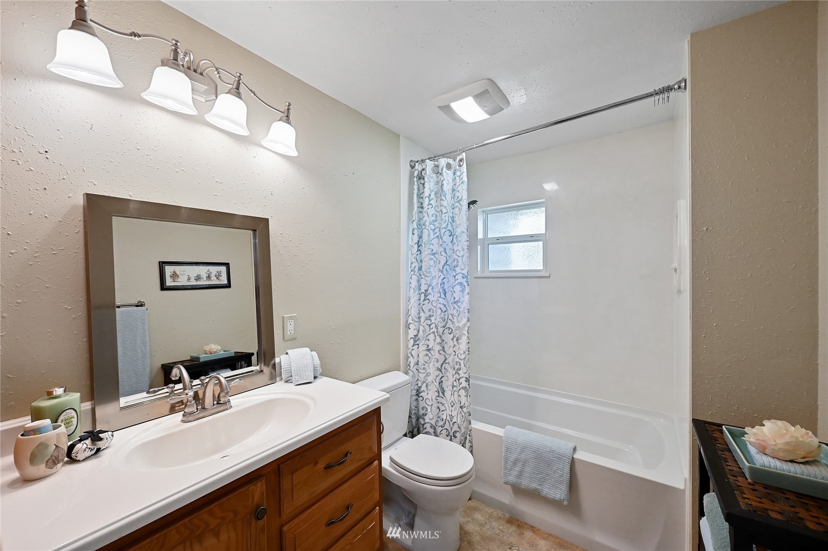17341 Southeast 134th Street Renton, WA 98059 - Photo 19 of 36 a bathroom with a double vanity sink toilet mirror and shower