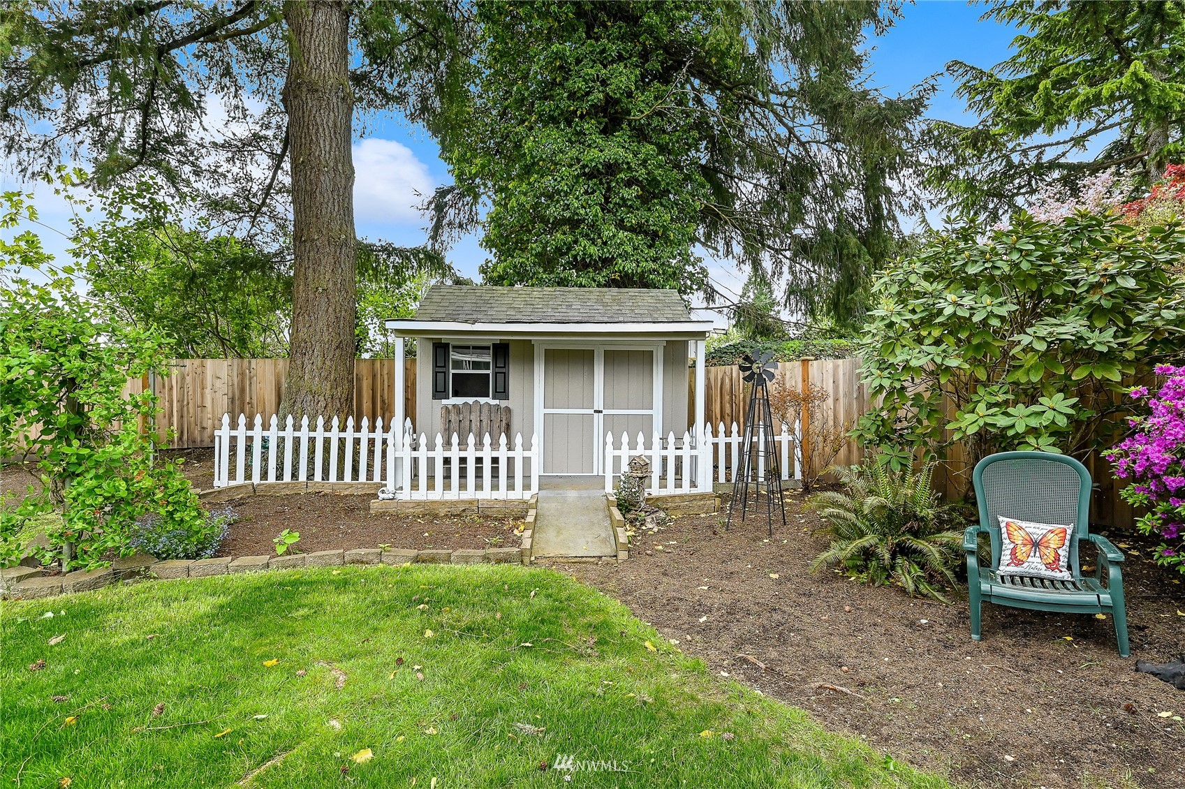 17341 Southeast 134th Street Renton, WA 98059 - Photo 26 of 36 a front view of a house with a garden