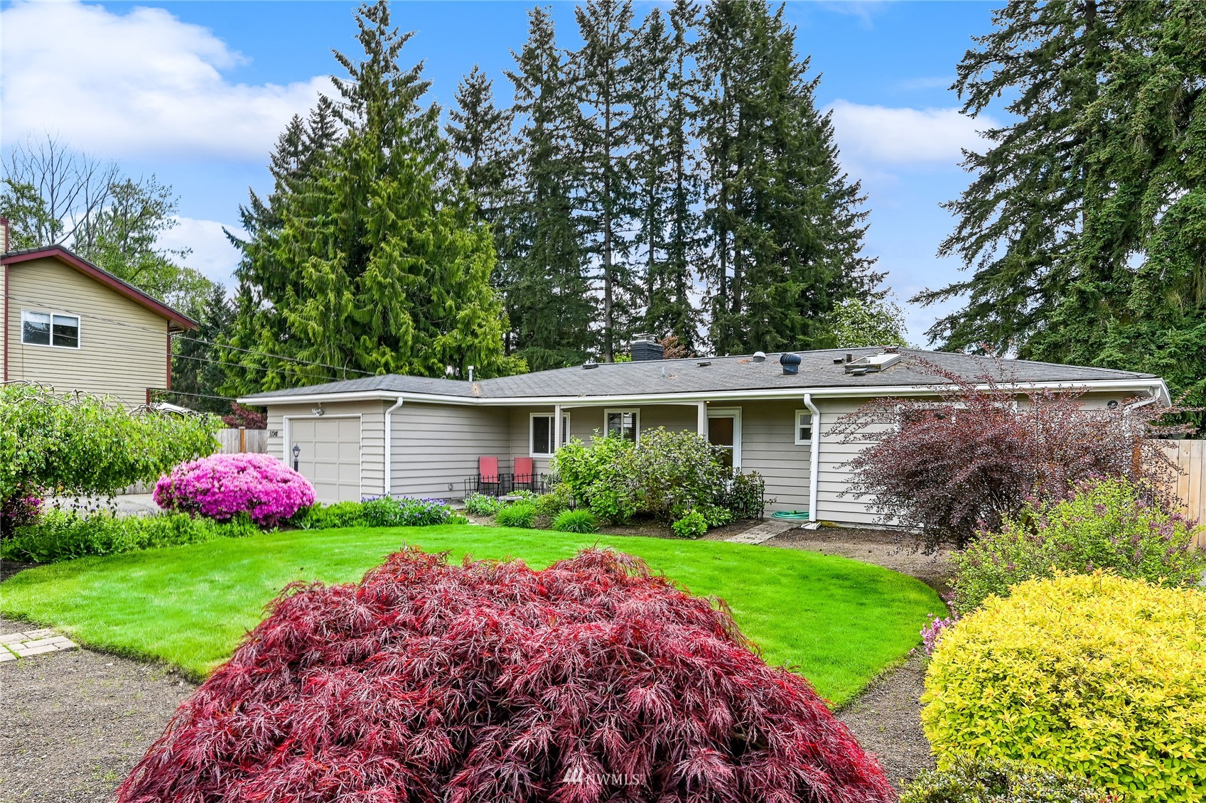 17341 Southeast 134th Street Renton, WA 98059 - Photo 3 of 36 a view of a house with a big yard and potted plants
